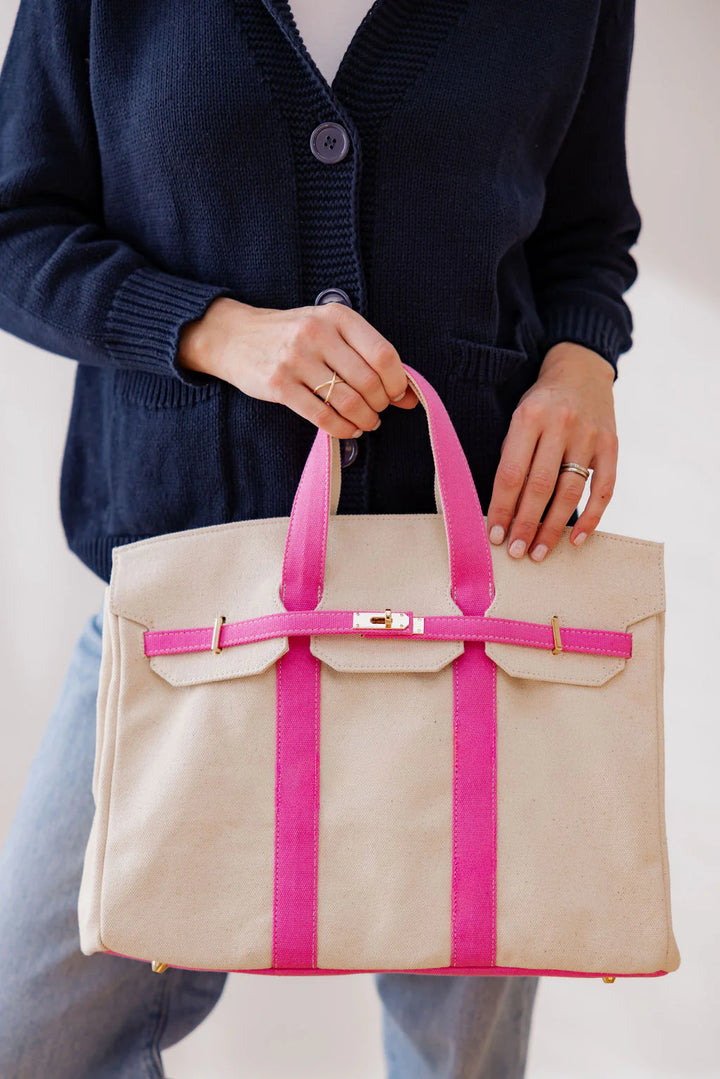 Timeless sophistication meets effortless coastal living. Our Preppy Boat tote is crafted for the woman who lives for sun drenched days, crisp white decks and dockside cocktails. Designed with the perfect blend of structure and style, this tote is made from durable canvas and polished hardware which give it gives it an unmistakable refined edge. Whether you&