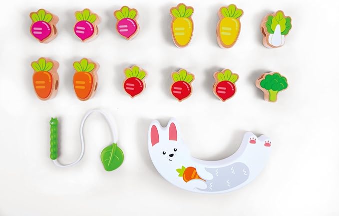 Set of colorful wooden vegetable-shaped toys on a white background