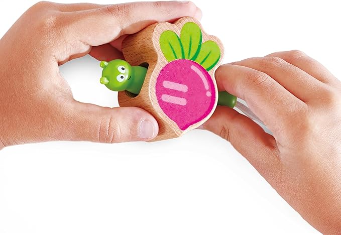 Wooden toy with a radish design held by two hands on a white background