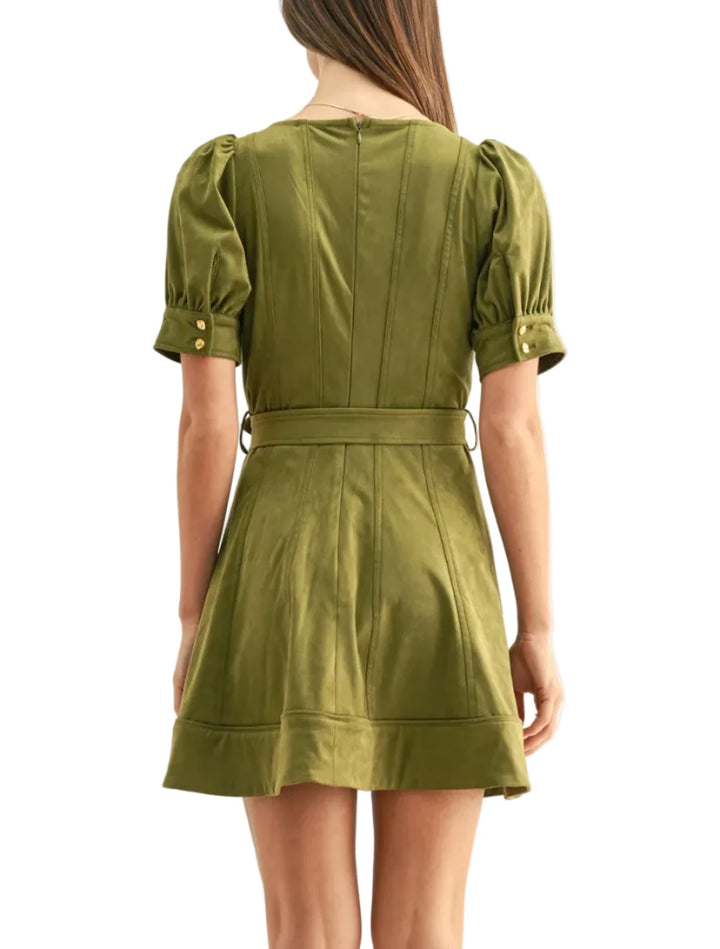 Crafted from a premium faux suede fabrication in a rich, earthy olive colorway, the dress offers a velvety, matte finish that enhances its sculpted silhouette. The design features a flattering, wide square neckline that meets a corsetry-inspired bodice detailed with vertical seam panels to elongate the frame. 
