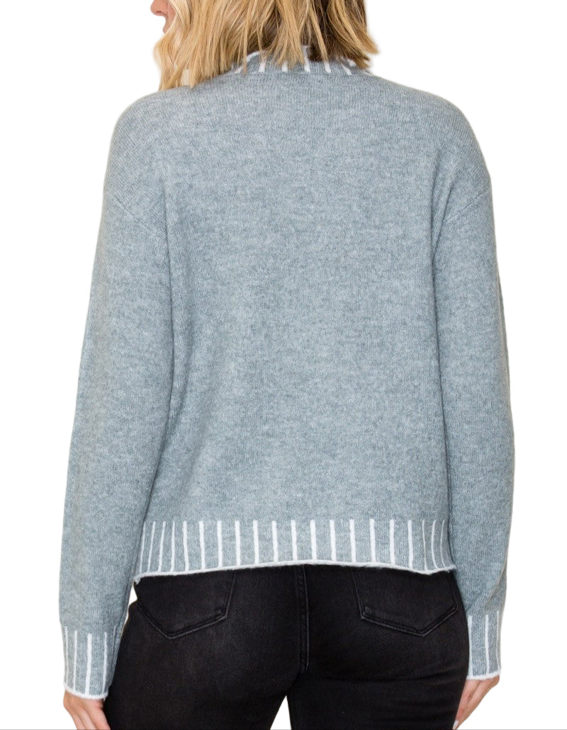 Stay cozy and stylish in the Kerr Mock Neck Sweater, featuring a charming color texture accent that adds a fun twist to your everyday look. Its playful mock neck design keeps you snug while letting your personality shine. Perfect for layering or wearing solo, this sweater brings warmth and a pop of character to chilly days.
