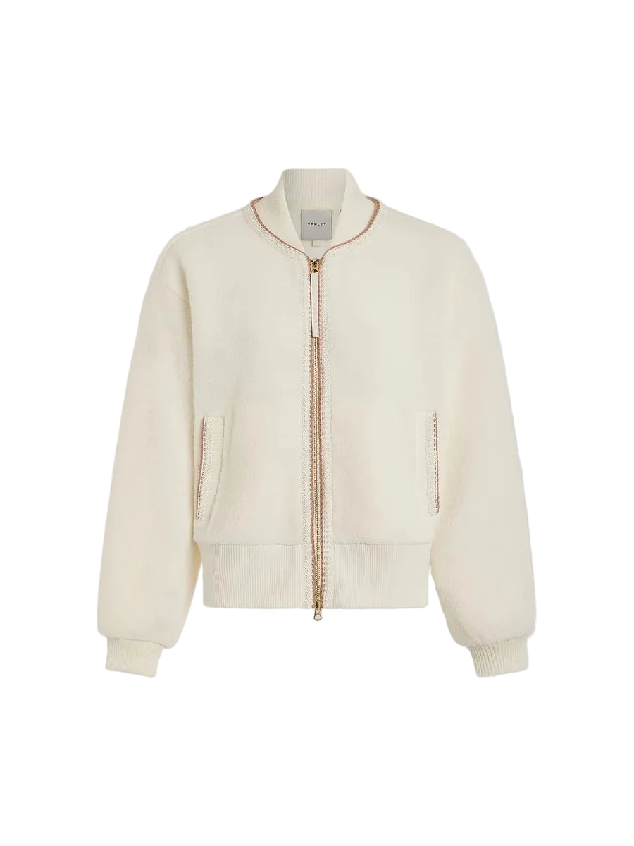 An off-white cropped zip-up jacket with gold-toned zipper details and contrast stitching, displayed on a neutral light gray background.