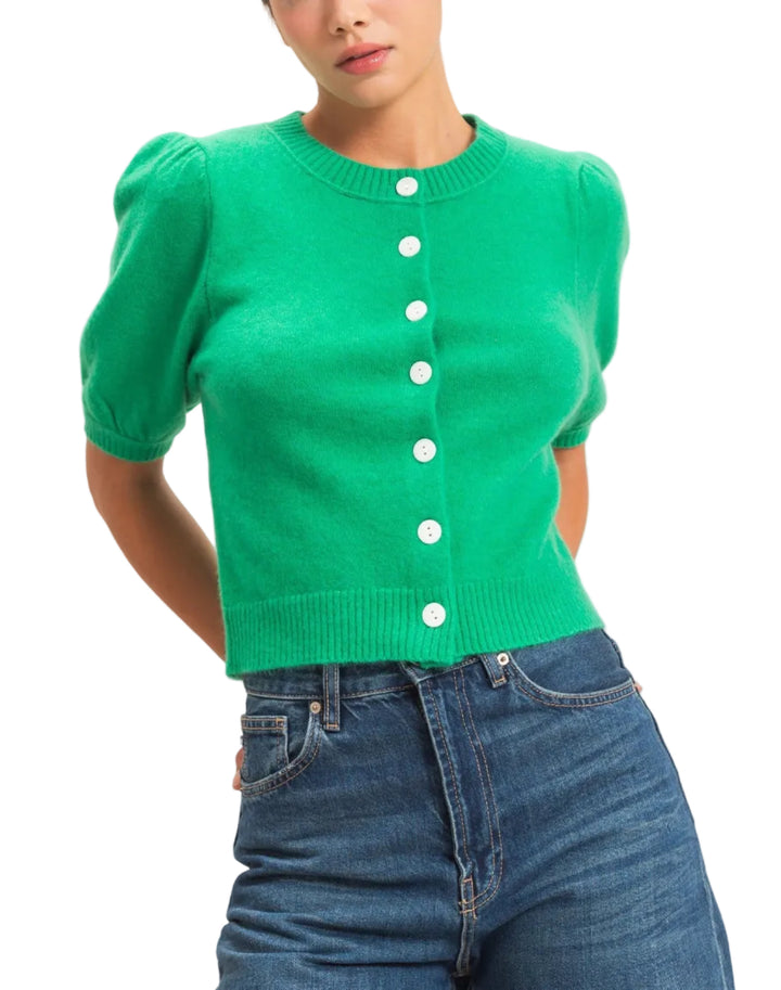 Experience comfort in this stylish button front cardigan featuring charming puff sleeves and a finely ribbed hem and neck. The knit construction provides a comfortable fit with a ribbed hem and cuffs. Perfect for layering over dresses or pairing with high-waisted trousers for a chic, modern aesthetic.