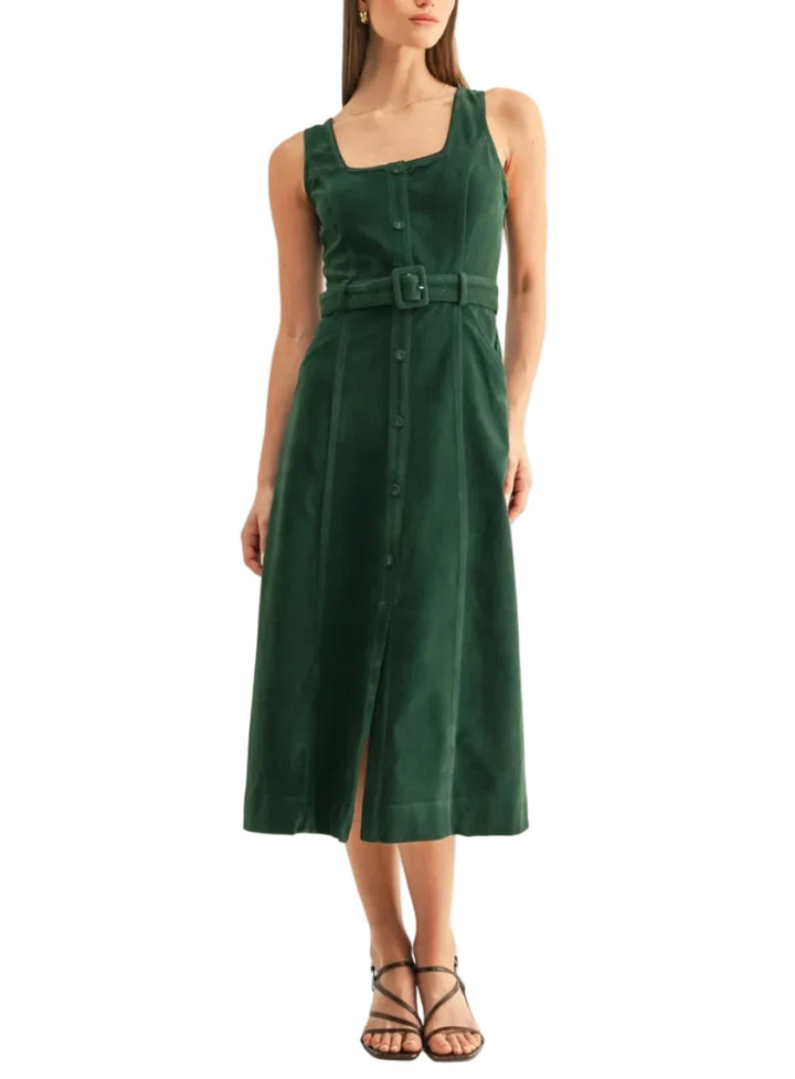 A woman modeling a sleeveless dark green midi dress with a square neckline, front button closure, and a matching belt at the waist, photographed against a plain light background.