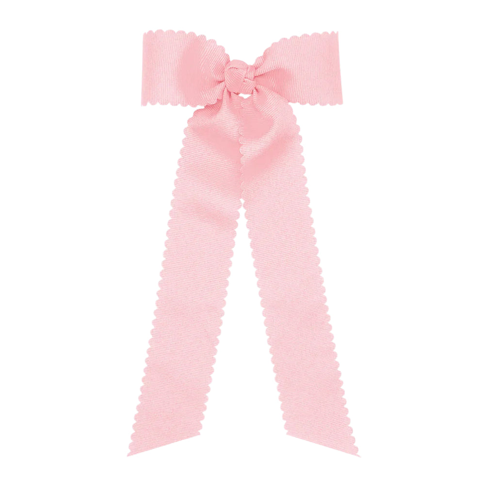 Large pink bow on a white background