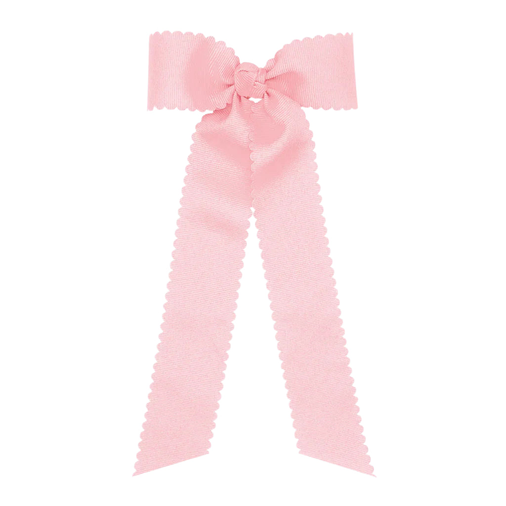 Large pink bow on a white background