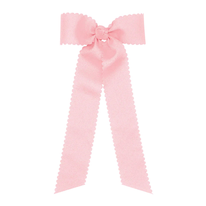Large pink bow on a white background