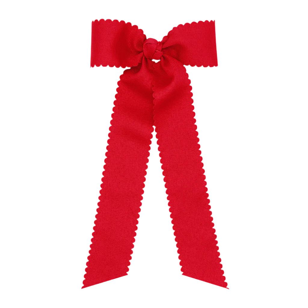 Red bow with ruffled edges on a white background