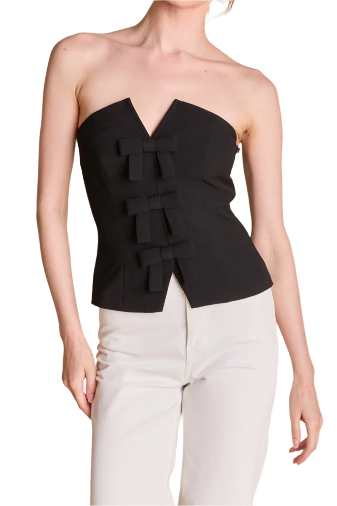 ntroducing our must-have Strapless Bustier Top with Bow, the perfect addition to your summer wardrobe. This top features a flattering strapless design, front bow details for a touch of femininity, and a convenient front snap button closure. Fully lined for ultimate comfort and support, this top is perfect for any occasion. Made from high-quality materials, this top is not only stylish but also durable.
Hand Wash Cold
Do Not Bleach
Iron Low
Do Not Tumble Dry
Shell: 95% Polyester 5% Spandex
Lining: 80% Polyes