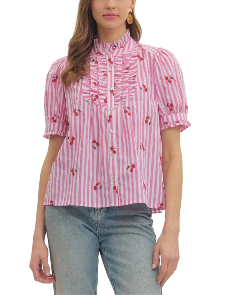 Striped embroidered cherry puff short sleeve top featuring ruffle bib front detail. Button closure at front. Ruffle trim at stand collar and sleeve cuff. Unlined. Woven. Non-sheer. Lightweight.