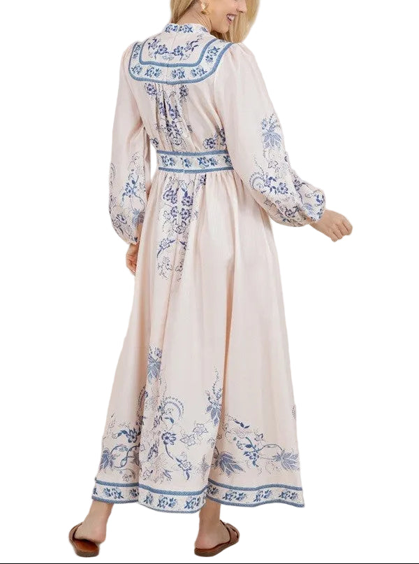 Effortless elegance meets everyday comfort in this printed long sleeve v-neck maxi dress. The flowing silhouette skims the body gracefully, while the classic v-neckline adds a touch of sophistication. Long sleeves provide coverage and versatility for any season, making it perfect for layering or wearing solo. The vibrant apricot print brings warmth and personality to your wardrobe. Ideal for casual outings, weekend brunches, or relaxed evenings out.
