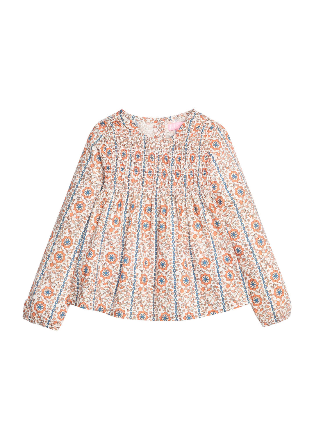 A long-sleeve smocked blouse with an intricate multicolor floral and geometric pattern on a cream base, featuring vertical smocked pleats at the bodice and cuffs.