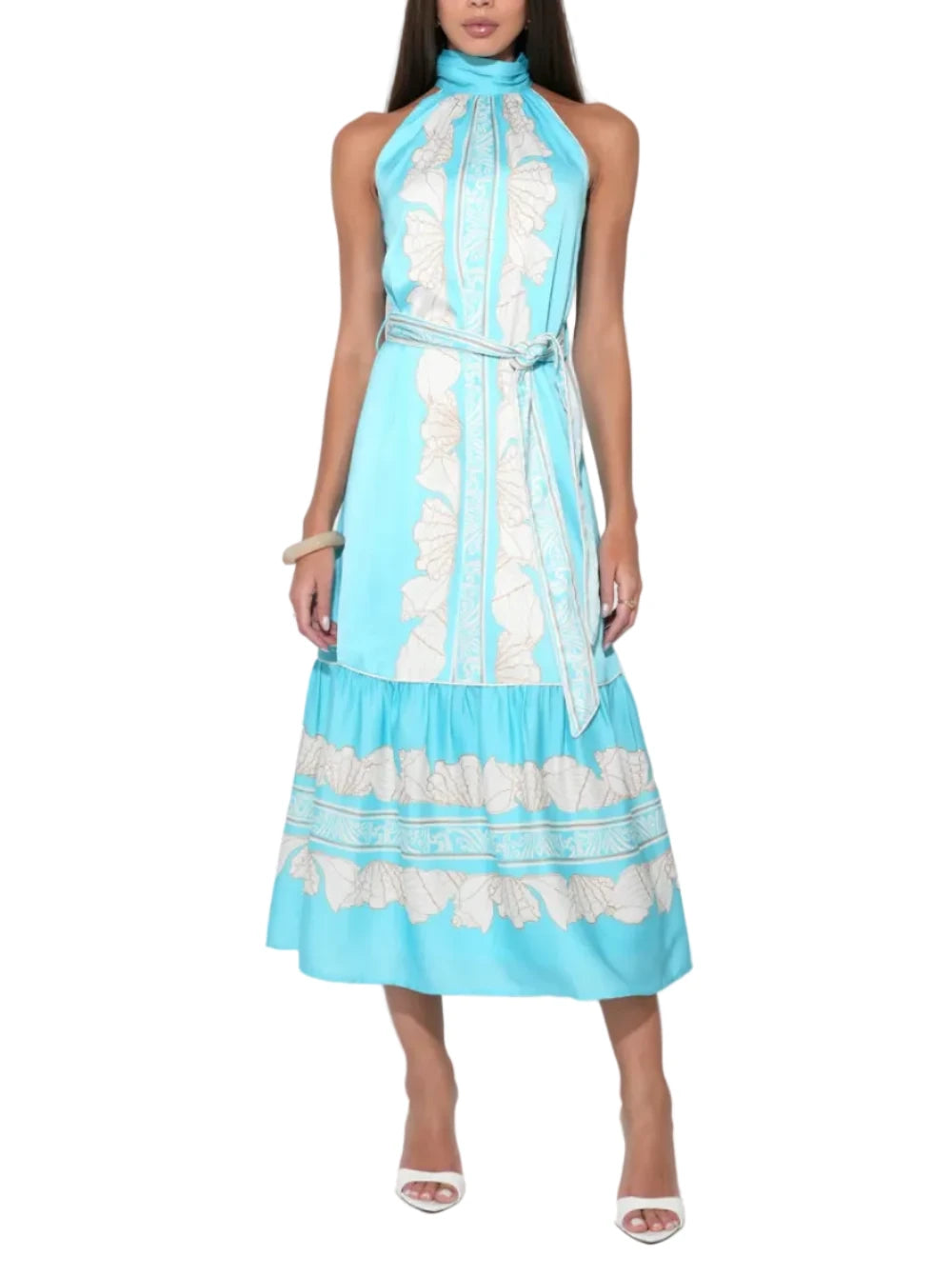 Drenched in a tranquil Seafoam and Ivory palette, this sweeping maxi dress features a whimsical all-over seashell print that feels both sophisticated and playful. The silhouette is defined by a chic halter neckline that elegantly frames the shoulders, leading into a fluid, floor-grazing skirt. Designed to capture the light and the breeze, the Ariella offers a relaxed yet refined fit that transitions seamlessly from day to evening.