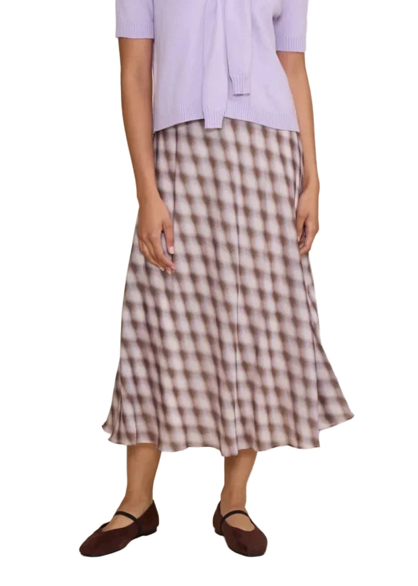 This effortlessly feminine midi skirt features a soft lavender and brown check pattern for a vintage-inspired look. Designed with a flattering A-line silhouette and fluid drape, it pairs beautifully with sweaters, blouses, or simple tees.
