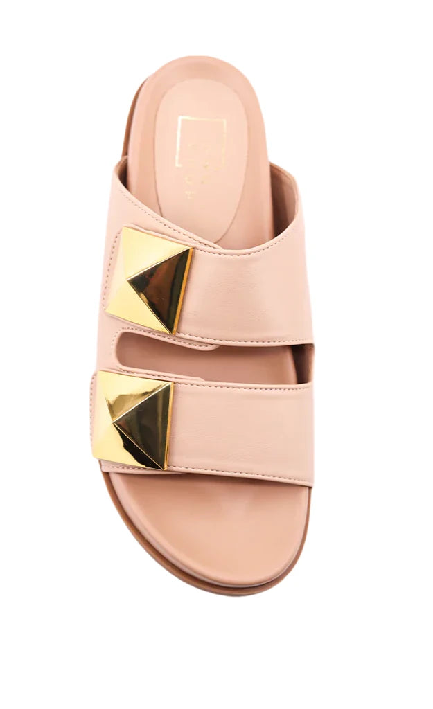 Step into elegance with our BERNARDA slides in smooth nude faux leather. Featuring wide straps and bold gold-tone studs, these sandals offer a chic, modern edge. With molded footbeds for comfort, they're the perfect stylish addition to your warm-weather wardrobe.