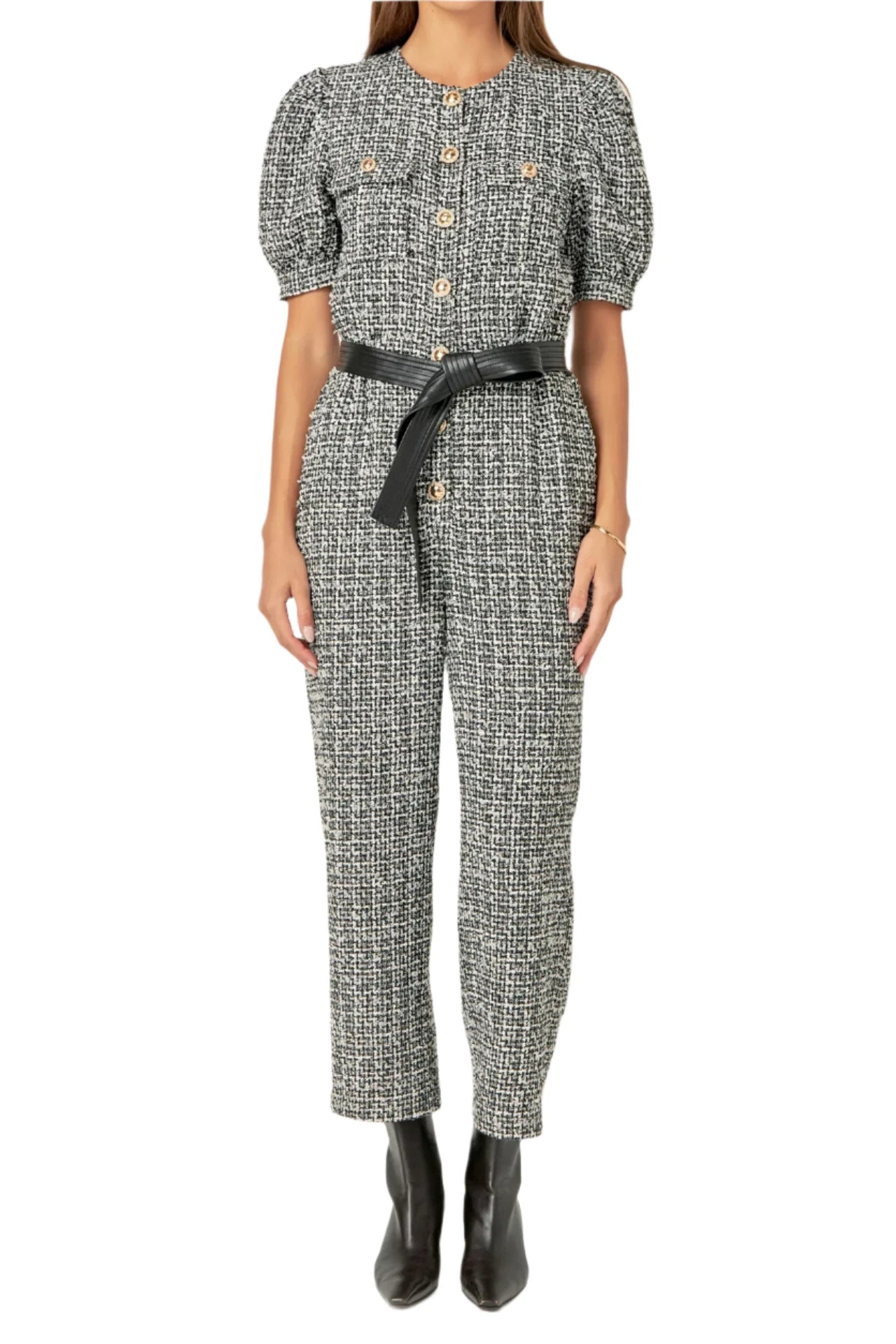 Featuring a classic round neckline short puff sleeves and a front button-down closure this chic jumpsuit is designed with a waist-cinching PU leather belt to add extra flair.