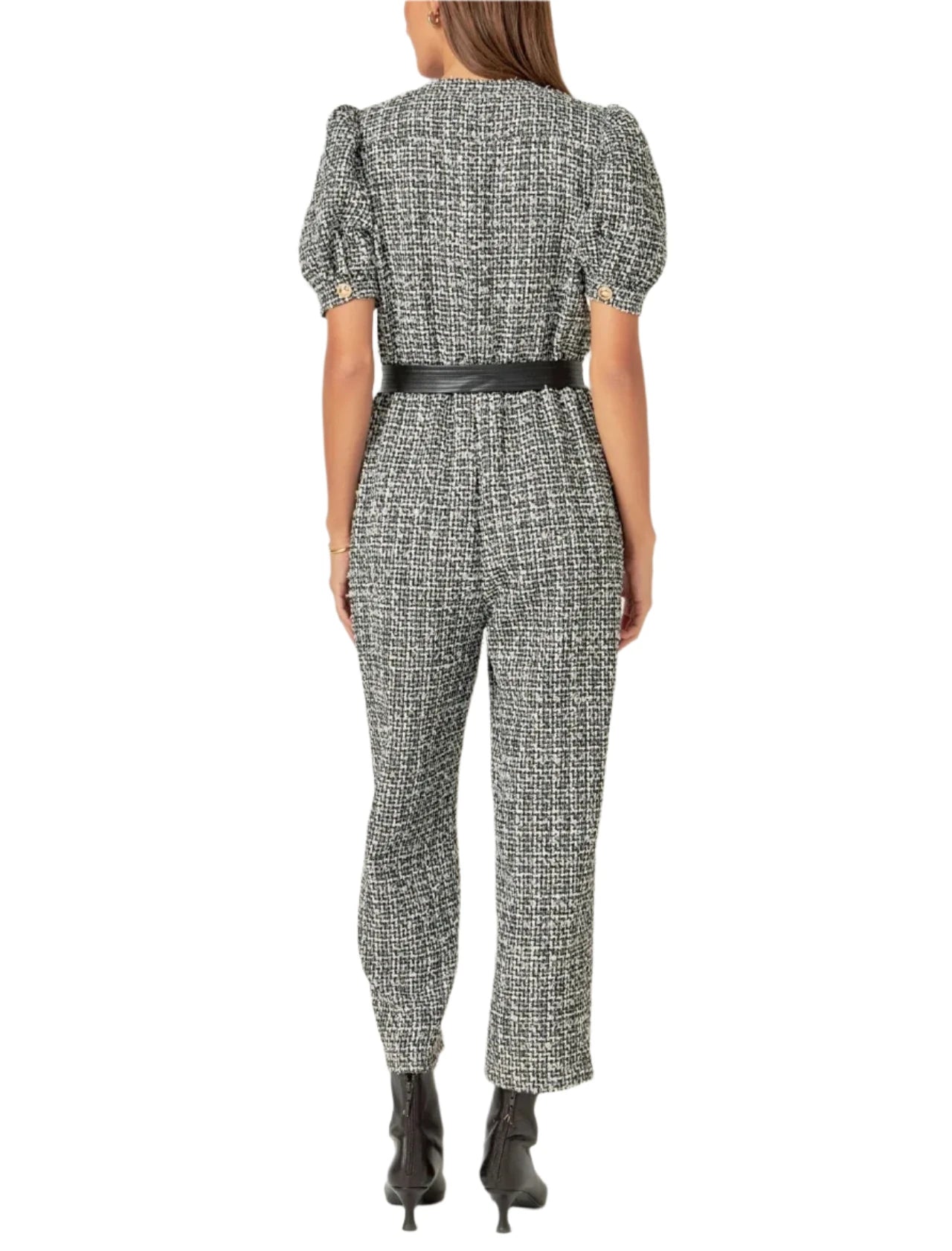 Featuring a classic round neckline short puff sleeves and a front button-down closure this chic jumpsuit is designed with a waist-cinching PU leather belt to add extra flair.