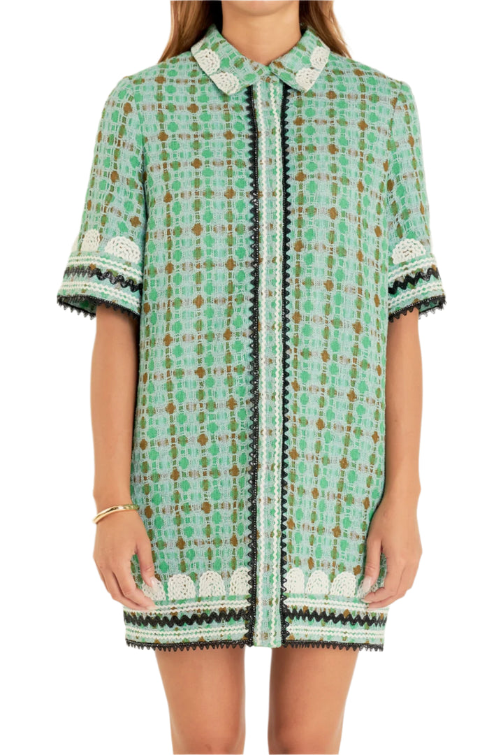 This Boucle Mini Shirt Dress With Ric Rac Trim is a stylish and modern dress for any occasion. It features a mini-length, shirt collar and all-over boucle fabric for an eye-catching look. The ric rac trim across the chest gives a chic and stylish contrast to the dress. It's perfect for the fashion-forward individual who wants to make a statement.
Hand wash cold