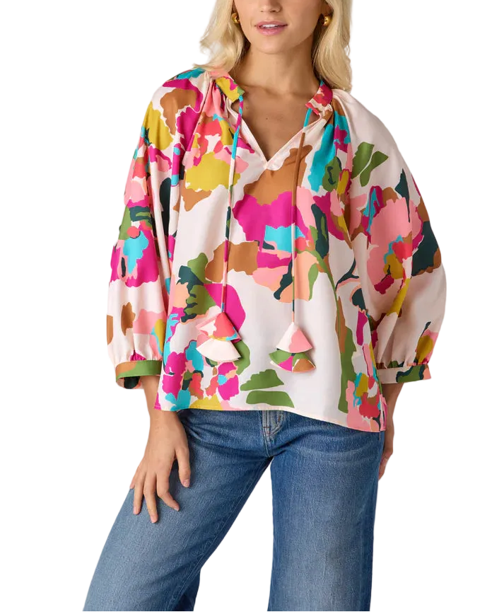  A fresh take on a fan favorite, the Marin combines a flattering split V-neckline, subtle balloon sleeves, and decorative tassel ties. Effortlessly chic, it’s designed to take you from morning meetings to weekend brunches all season long.