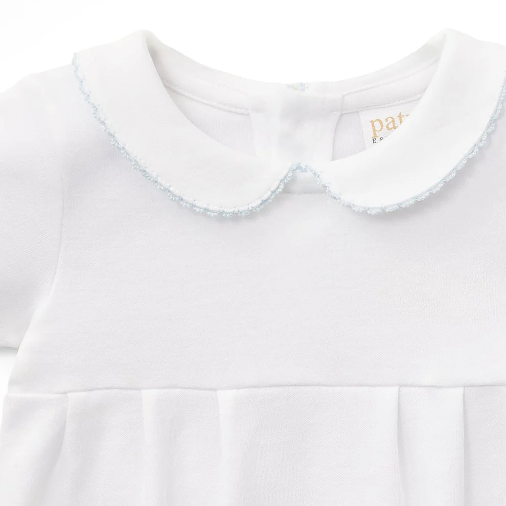 A timeless addition to baby boy’s wardrobe, this classic bubble is crafted from soft organic cotton knit fabric for a light, breathable feel. Designed with a traditional Peter Pan collar accented by delicate picot trim, it features a refined pleated front for a polished, heirloom-inspired look. Comfortable enough for everyday wear yet elevated enough for special occasions, this versatile style is perfect for family gatherings, photos, celebrations, and milestone moments. The gentle silhouette allows for eas