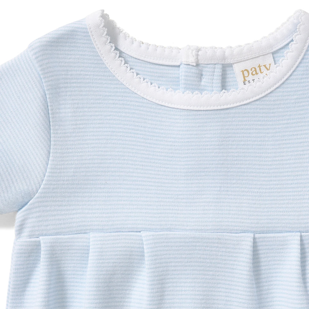 A timeless essential for baby, this classic bubble is crafted from soft, breathable organic cotton interlock fabric for all-day comfort and gentle wear on delicate skin. Designed with a clean, traditional silhouette, it features delicate picot trim along the neckline and a softly pleated front for a refined, heirloom-inspired look. &nbsp;The lightweight fabric allows for easy movement, while bottom snaps provide quick and convenient diaper changes. Perfect for everyday wear, special occasions, and baby gift