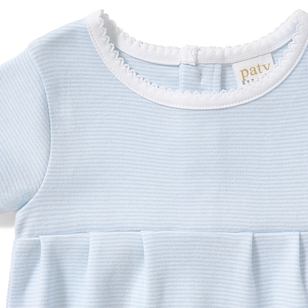 A timeless essential for baby, this classic bubble is crafted from soft, breathable organic cotton interlock fabric for all-day comfort and gentle wear on delicate skin. Designed with a clean, traditional silhouette, it features delicate picot trim along the neckline and a softly pleated front for a refined, heirloom-inspired look. &amp;nbsp;The lightweight fabric allows for easy movement, while bottom snaps provide quick and convenient diaper changes. Perfect for everyday wear, special occasions, and baby gift