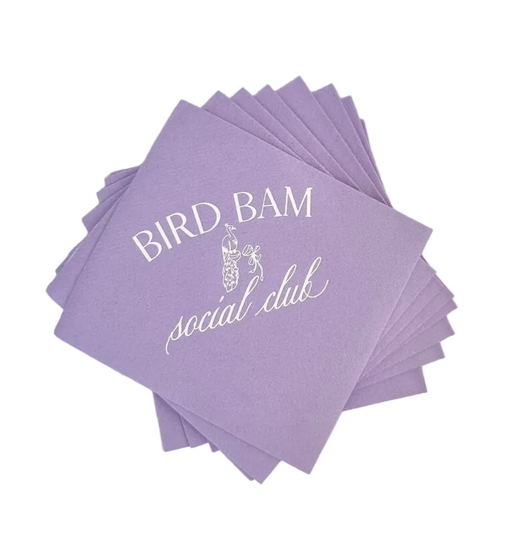 Stack of purple napkins with &