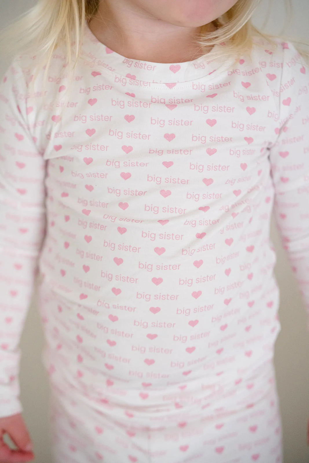 Child wearing a pink &