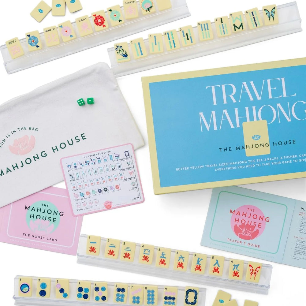 Perfectly sized for on-the-go play, this travel-friendly set includes:
1 set of 160 travel-sized mahjong tiles (36 dots, 36 bams, 36 craks, 8 flowers, 16 winds, 4 white dragons/soaps, 4 green dragons, 4 red dragons, 10 jokers, 6 blanks)
4 racks
1 pusher
1 tile guide
1 player’s guide to mahjong
4 of our House Cards
1 zipper travel bag

Materials:
tiles, racks, and pusher are plastic

Tile dimensions:
36mm x 25mm x 3.6mm

Rack dimensions:
35.8cm x 5.5cm x 2.4cm

Pusher dimensions:
35.8cm x 3cm