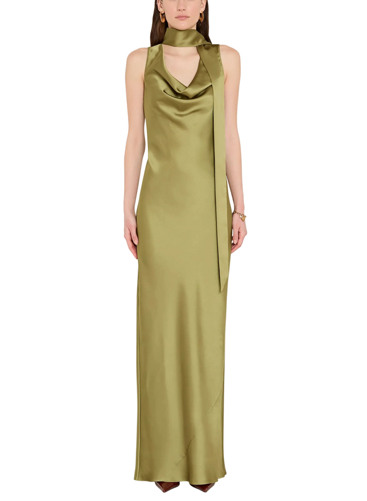 
The Paula Maxi in vert, an elegant olive green. This floor-length gown is cut on the bias from luxurious charmeuse for an easy comfortable fit for all shapes. The cowl neck features an attched scarf detail that can be styled in various ways.