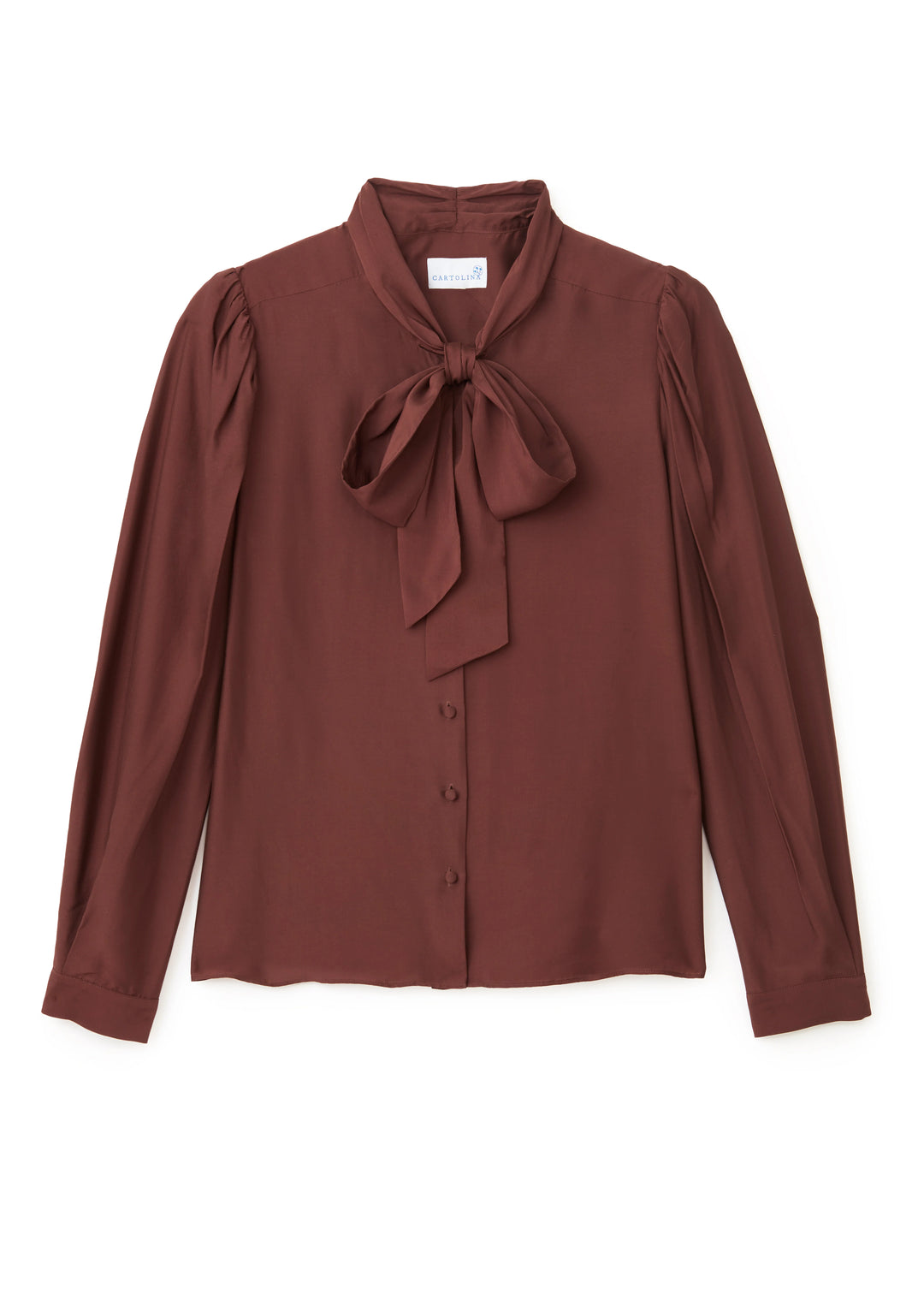 The Peggy Long Sleeve Top in Espresso brings an allure to everyday dressing—crafted to drape beautifully, with subtle detail that add the perfect touch.

Subtle Contrast: Self neck tie and covered buttons
Draped Ease: Relaxed fit with airy silk-blend softness
Elevated Shape: Shirred sleeve cap and fluid hem slits