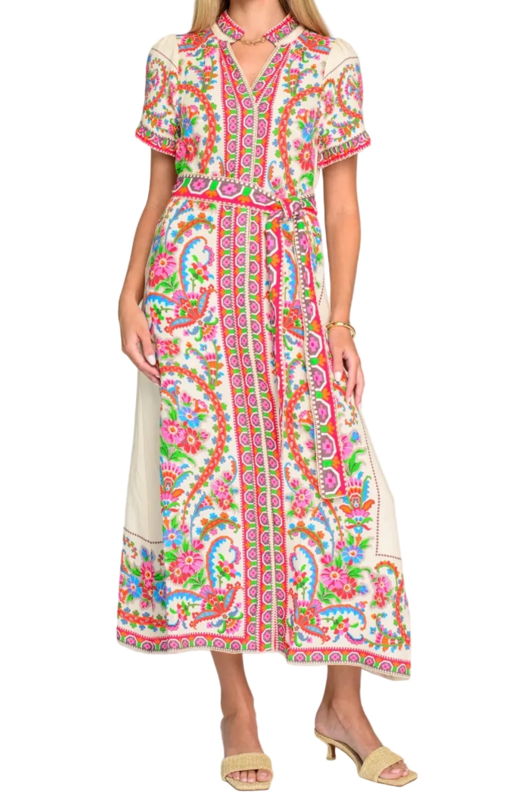 Woman wearing a colorful patterned dress on a white background