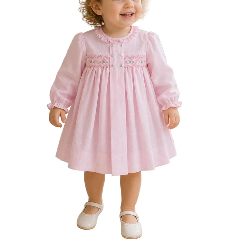 AN CLASSIC AND SIMPLE DRESS THAT IS PERFECT FOR FALL WITH CHARMING SMOCKING AND DELICATE EMBROIDERY, YOUR LITTLE ONE WILL BE COMFORTABLE WITH A TOUCH OF SWEETNESS!

This long sleeve dress comes in a pink check fabric that is perfect for fall and winter with a center box pleat with decorative buttons and a smocked panel with embroidered details.

The lightweight cotton blend fabric keeps little ones cool and comfortable and is easy to care for - just machine wash and tumble dry. 