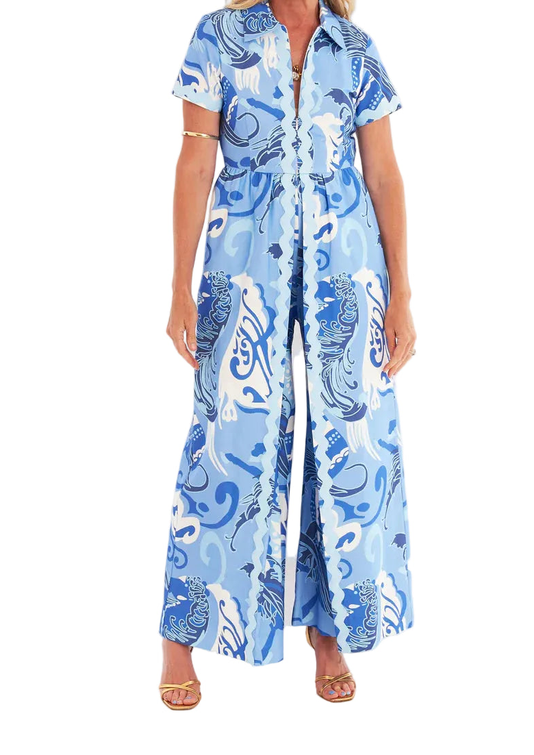 Woman wearing a blue patterned dress on a white background