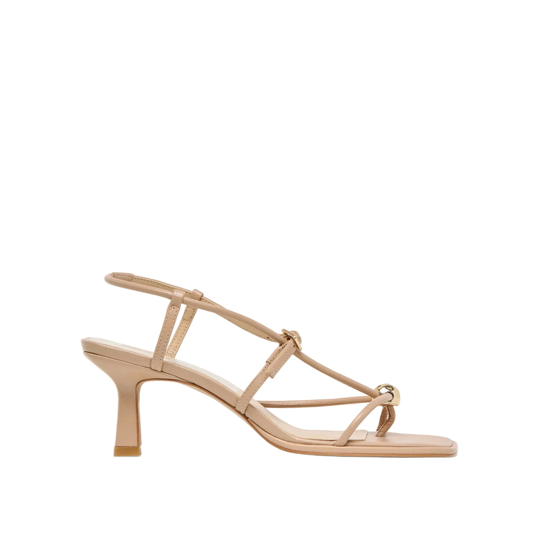 MYLEE’s understated and strappy design goes with every event look. With of-the-moment details like a leg-elegonating architectural heel, squared off toe, and adjustable strap topped with a gleaming gold hardware accent, she’s both effortlessly cool and so polished. This sustainable heel is available in too many essential colorways to choose from—from shining gold and silver metallics, to classic neutrals, to bold statement colors. She pairs perfectly with cocktail dresses and matching sets for every wedding