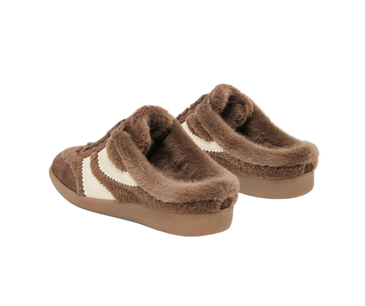 MERIT SLIDE PLUSH delivers cozy, effortless style with a plush finish and easy slip‑on silhouette. A soft shearling lining adds warmth and comfort, making this sneaker the perfect pair for quick errands, casual outings, or relaxed days at home. Available in dark brown or natural multi plush, this style delivers a laid‑back feel with modern street‑inspired design. Cushioned, lightweight, and endlessly wearable, MERIT SLIDE PLUSH is the slip‑on you’ll keep by the door all season long.
