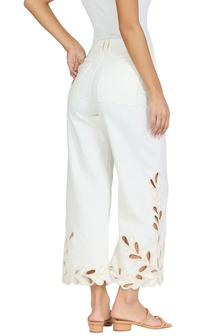 Embrace a chic and stylish look with these high rise wide leg cropped jeans, featuring an intricate scalloped hem and detailed embroidery.

Perfectly designed for versatility and comfort, the jeans are made from stretch denim in a classic white color, providing the ideal balance of utility and fashion for any lifestyle.

Elevate your wardrobe with this go-to piece that pairs effortlessly with your closet staples.

Whether you&