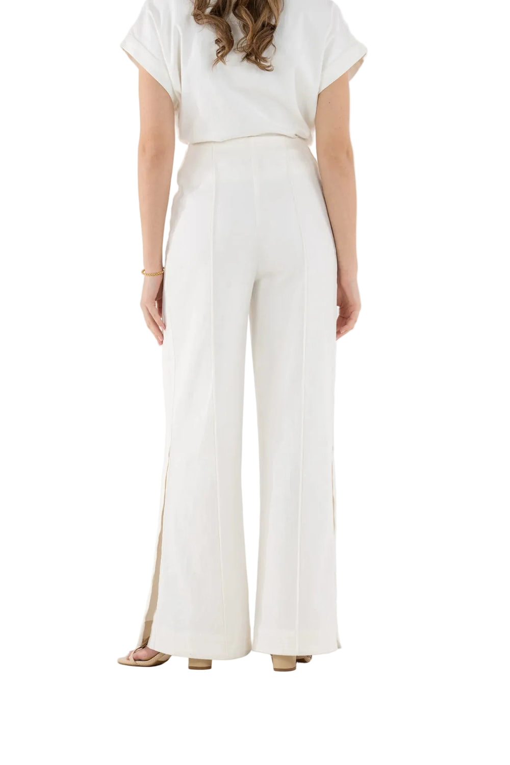 The Piper Pant in Gardenia Denim is a refined essential designed with effortless polish in mind. Featuring a flattering high-waisted silhouette, this style is detailed with crisp pintuck seams that elongate the leg and create a clean, tailored line. Subtle side slits at the hem add movement and a modern finish, giving the pant a light, fluid feel. Polished yet easy to wear, the Piper Pant balances structure with softness, making it a versatile foundation for elevated everyday dressing.