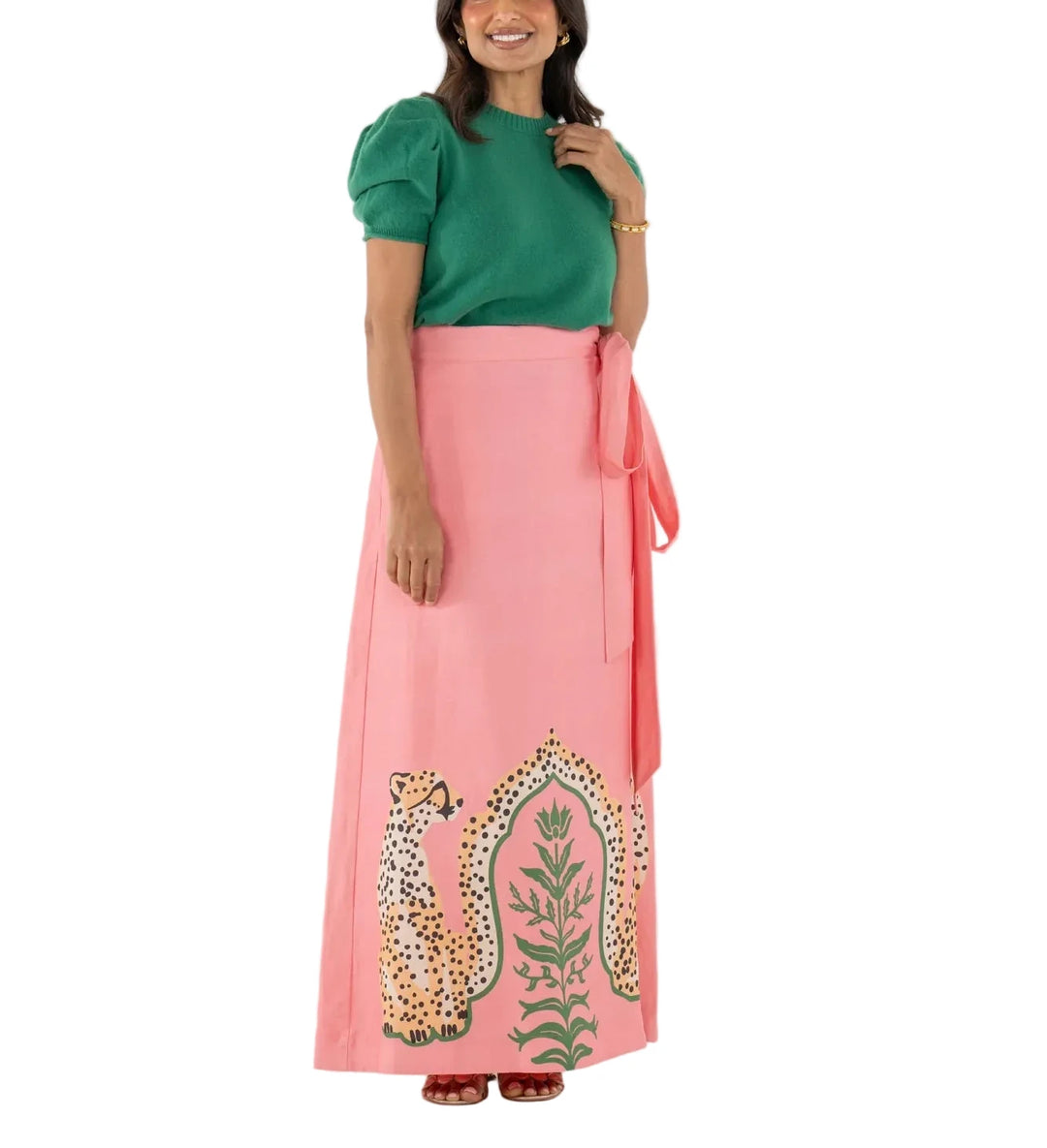 The Audrey Skirt in Cabana Cat is a statement in fluid playfulness. Designed with a high-waisted silhouette, it features a pre-tied, tacked bow at the waist and a clean side zip closure for a clean finish. The Cabana Cat motif introduces a sense of whimsical majesty, showcasing symmetrical regal cheetahs framing lush greenery for a look that feels both artful and elevated.