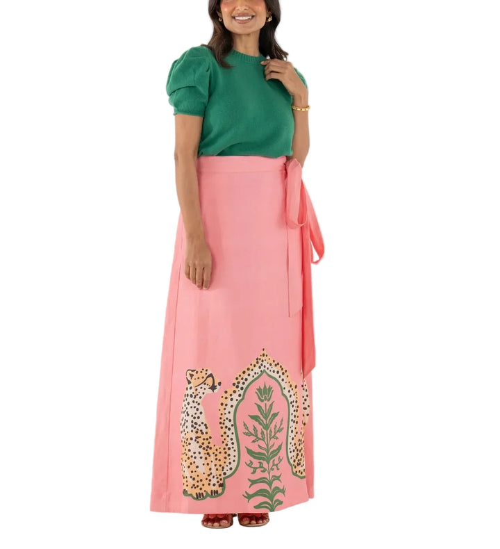 The Audrey Skirt in Cabana Cat is a statement in fluid playfulness. Designed with a high-waisted silhouette, it features a pre-tied, tacked bow at the waist and a clean side zip closure for a clean finish. The Cabana Cat motif introduces a sense of whimsical majesty, showcasing symmetrical regal cheetahs framing lush greenery for a look that feels both artful and elevated.