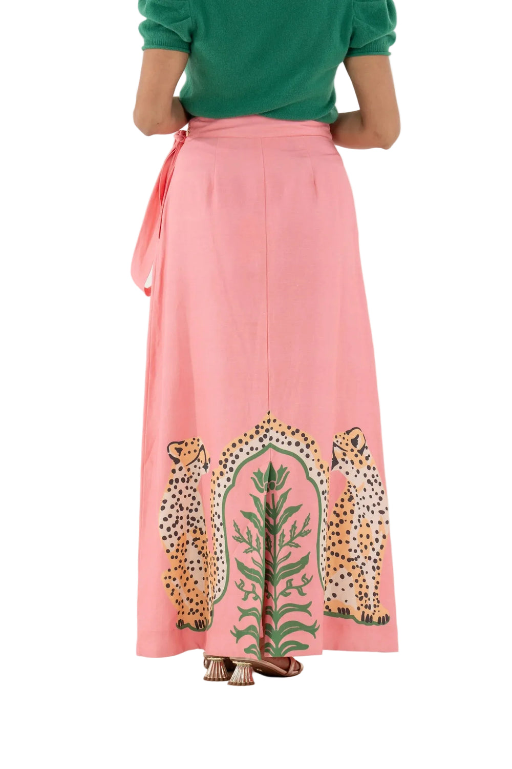 The Audrey Skirt in Cabana Cat is a statement in fluid playfulness. Designed with a high-waisted silhouette, it features a pre-tied, tacked bow at the waist and a clean side zip closure for a clean finish. The Cabana Cat motif introduces a sense of whimsical majesty, showcasing symmetrical regal cheetahs framing lush greenery for a look that feels both artful and elevated.