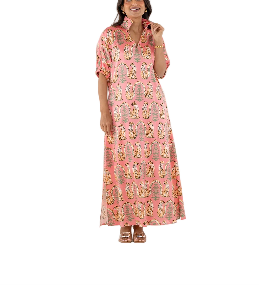 The Poppy Maxi in Cabana Cat is an understated statement with a playful edge. Designed with a classic stand collar, relaxed dolman sleeves with soft elastic, and a loose, flowing silhouette, it moves with ease and grace. The Cabana Cat print brings a sense of whimsical majesty, featuring regal cheetahs set within a symmetrical jungle of architectural motifs—perfect for elevated occasions that call for ease and impact.