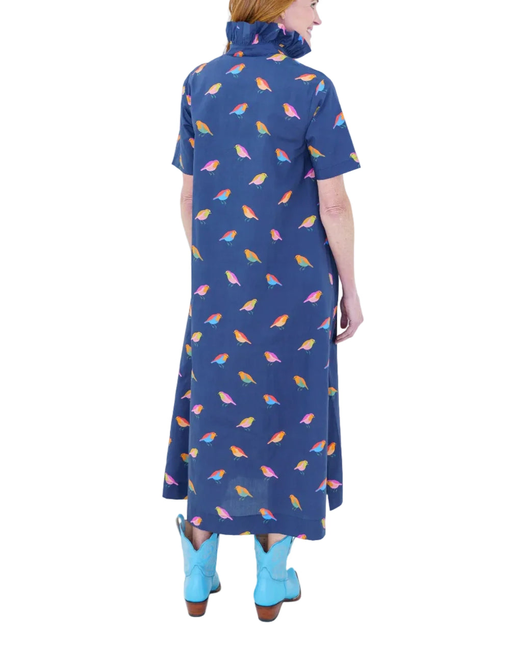 Our best-selling Georgia body is back in a whimsical bird print made for fall. Crafted from crisp cotton poplin, it features a flattering A-line silhouette, feminine ruffle neckline, and an easy short sleeve with comfortable coverage. Pops of color throughout the bird print add a playful touch, while side pockets make it effortlessly practical for everyday wear.

Fabric: 100% Cotton Poplin
Length: 50 inches
Fit: Relaxed A-line silhouette.