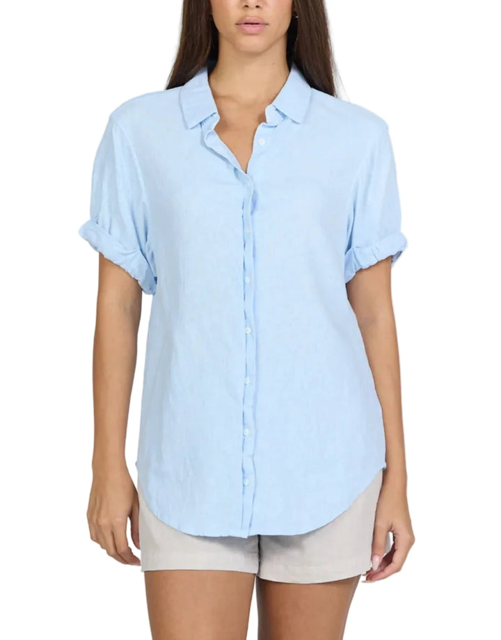 This garment washed short sleeve relaxed fit shirt is designed for comfort and ease with its rolled sleeves and exposed placket button-up collar.

Made from a breathable blend of woven fabrics, this skyway shirt offers a relaxed fit ideal for any occasion.

Perfectly versatile, it can be a staple in your top market collection and is also ideal for those seeking tops online or tops near me.

Its classic style and blue base color make it a go-to piece, merging quality with effortless style.

MATERIALS &amp; CARE
