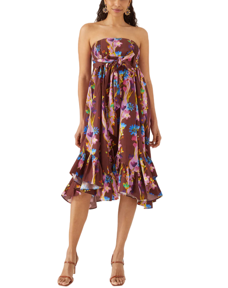 A flouncy maxi skirt that doubles as a strapless dress. Smocked side panels allow for a pull on style and easy fit