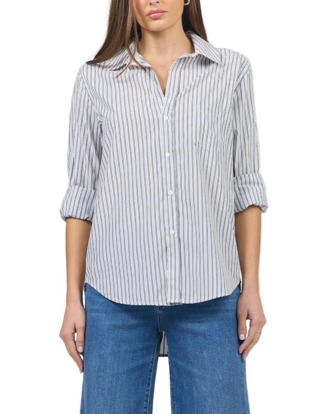 Woman wearing a striped shirt and blue jeans on a white background