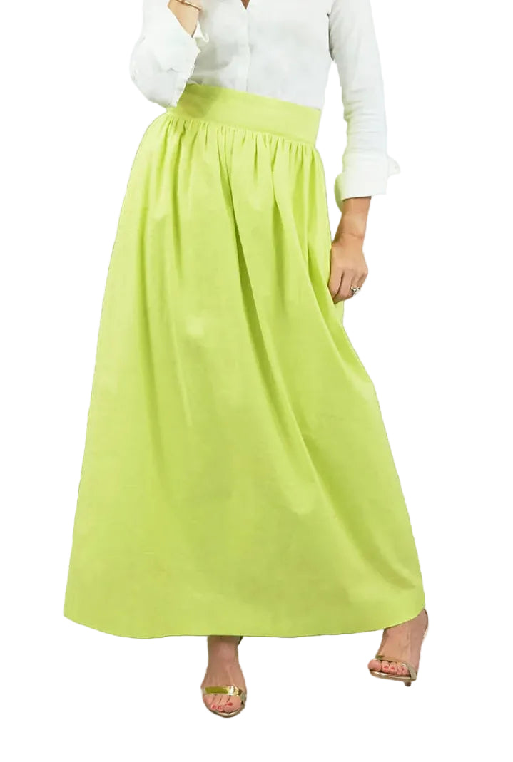 Woman wearing a white blouse and green skirt on a white background
