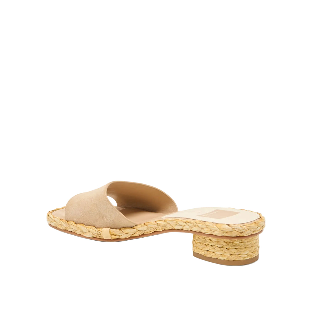 Your spring staple, perfected. DIXI pairs a sleek slide-on silhouette with a natural woven sole and slightly raised block heel for a casual yet chic look. You can’t go wrong with any of her essential warm weather shades—bone leather, platinum leather, camel suede, or brown suede. This easy breezy slip-on sandal is made for effortless styling with flowy cotton dresses, relaxed denim, or trending capris. Sustainably-crafted and made for all-day wear, this go-to works for any part of your week.

