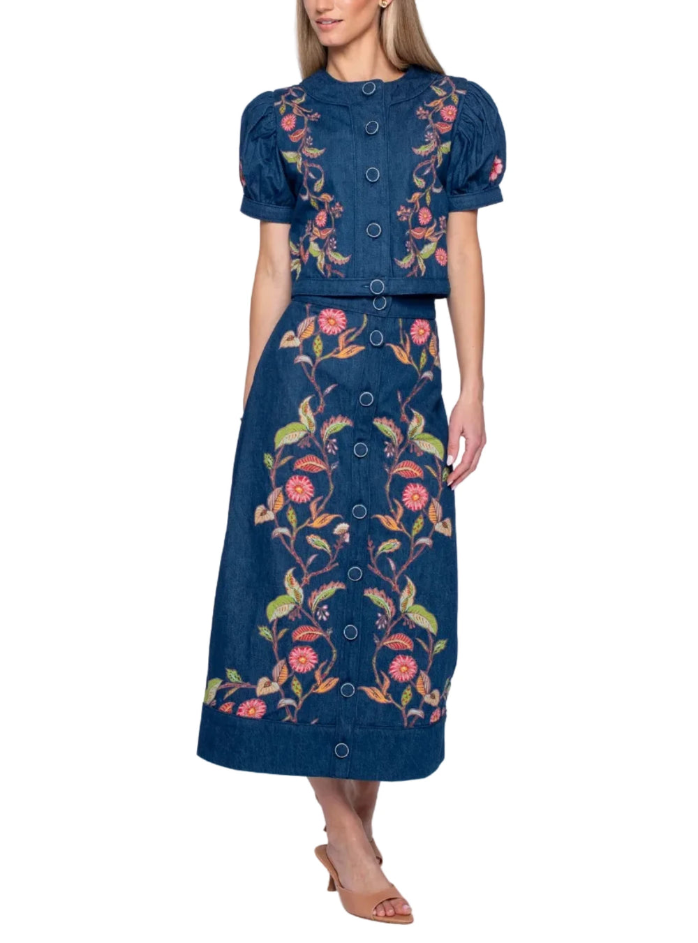 Feel fab in Frannie! This A-line, button front style boasts stunning floral embroidery on a dark wash cotton denim fabric. She looks great worn as part of a matching set or dressed down with a simple tee.

Complete the set! Pair with our matching Coco Top

Product Details

100% Cotton
A-line style
Button front
Embroidery