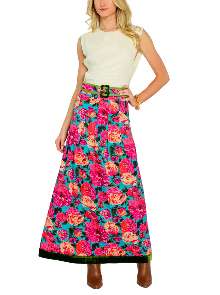 Tailored and classy, Peyton is our newest skirt silhouette. Her stitched down pleats create a slightly flared body, tied together with a pretty matching belt buckle and green velvet trim.

 